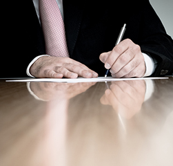 Man signing document